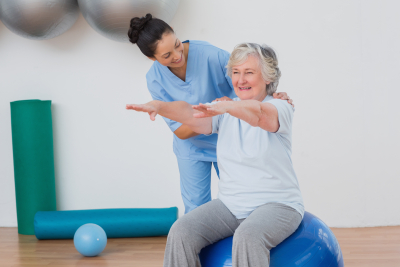 caregiver conducting physical theraphy indoor
